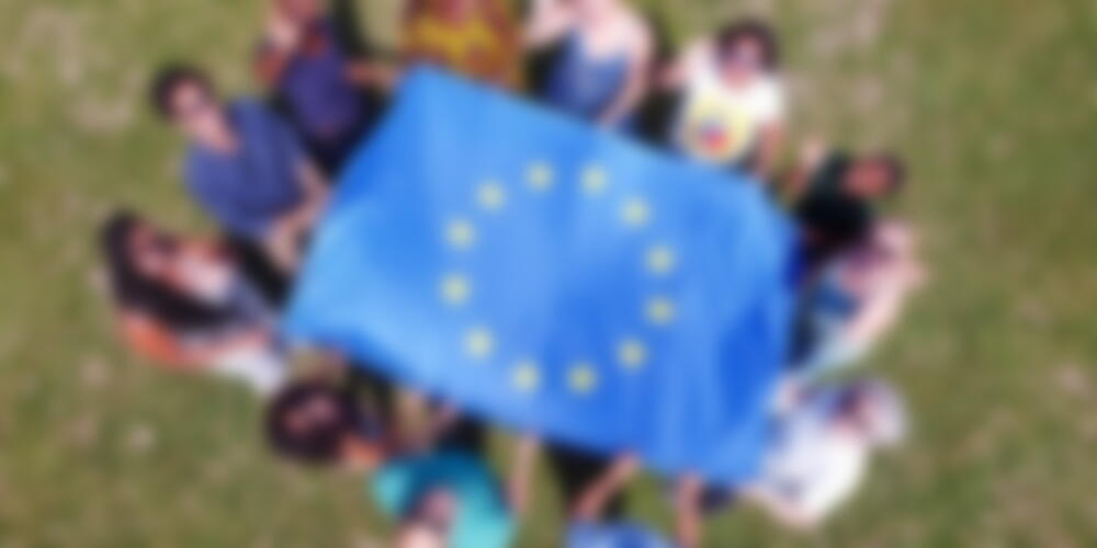 group of people with EU flag
